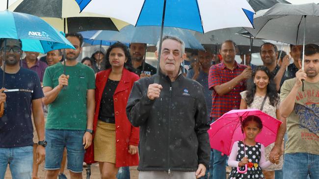 Local residents in Schofields’ Akuna Vista estate braved the rain in January to protest against a proposed suburb name change for their area. Centre: Matthew Coombes. Picture: Angelo Velardo