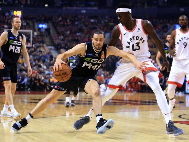 Melbourne United’s Chris Goulding goes against Toronto’s Pascal Siakam during the 2018 NBAxNBL clash. Picture: Getty Images/AFP