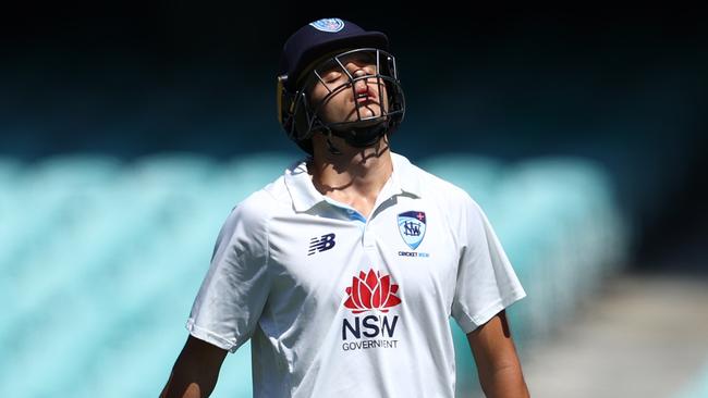 SYDNEY, AUSTRALIA - FEBRUARY 19: Sam Konstas of the Blues walks off the field after been dismissed by Scott Boland of Victoria during the Sheffield Shield match between New South Wales Blues and Victoria at Sydney Cricket Ground on February 19, 2025 in Sydney, Australia. (Photo by Jason McCawley/Getty Images)