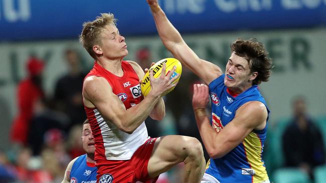 Sydney's Isaac Heeney   marks in front of Suns' Charlie Ballard  during AFL match Sydney Swans v Gold Coast Suns at the SCG. Picture. Phil Hillyard