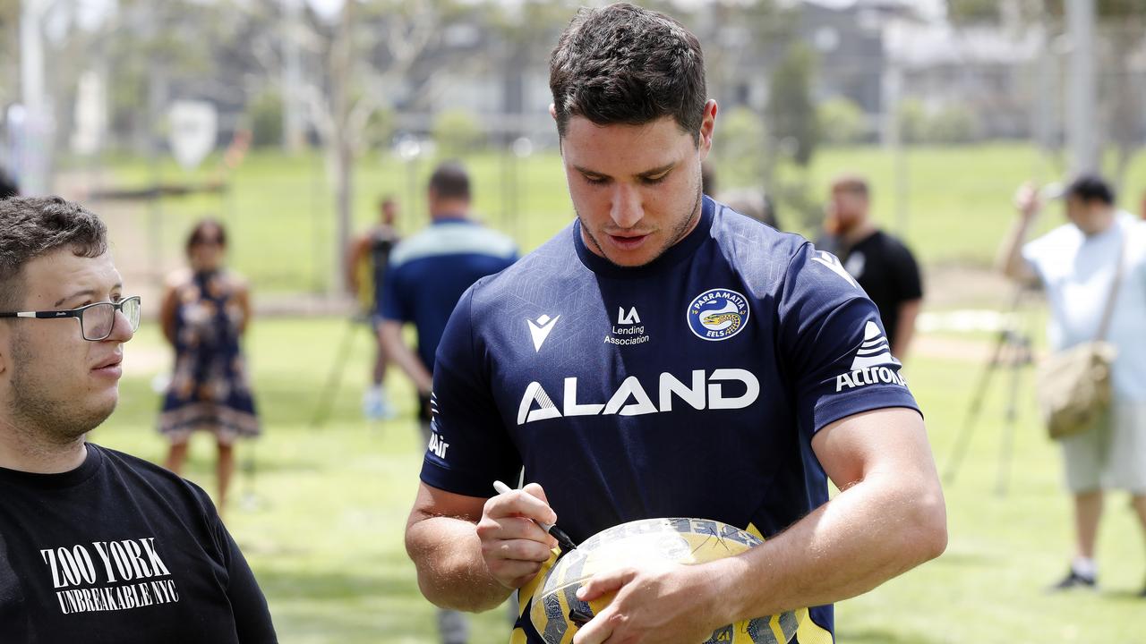 Parramatta halfback Mitchell Moses signs autographs for fans at Eels HQ in Kellyville. Where he signs his next contract is the big question. Picture: Jonathan Ng