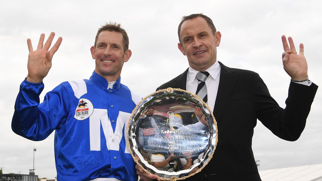 Hugh Bowman and trainer Chris Waller with the Cox Plate after Bowman rode Winx to victory for the fourth time in 2018