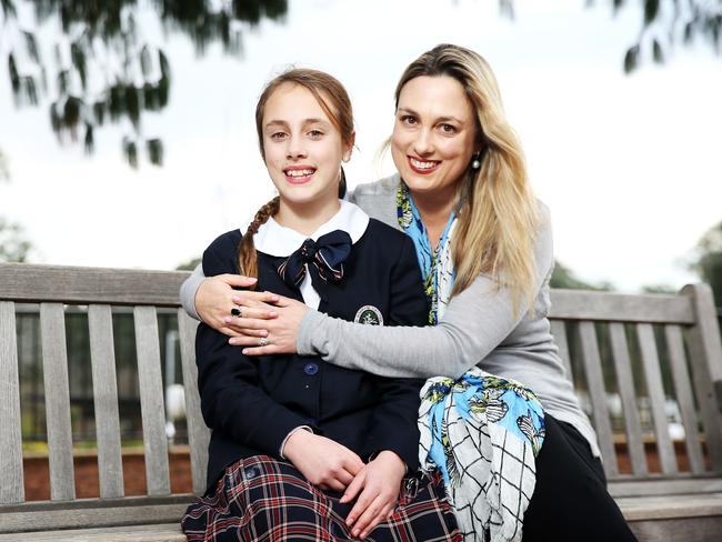 Louise Limbers of Wahroonga ensures 12-year-old daughter Claudia and her other children stop using devices well before bedtime. Picture: Tim Hunter