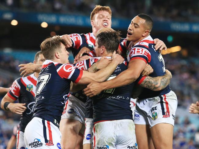 The Roosters celebrate Mitchell Pearce's match winning try during the Canterbury Bulldogs v  Sydney Roosters NRL round 11  game at ANZ Stadium, Sydney Olympic Park. pic Mark Evans
