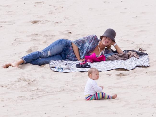 Lively relaxed while baby James played in the sand.