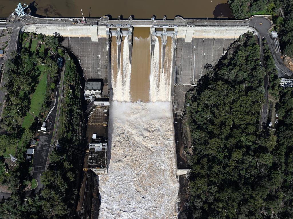 An aerial view of Warragamba Dam overflowing in the Western Sydney region where major floods hit the area. Picture: NCA NewsWire / Gaye Gerard