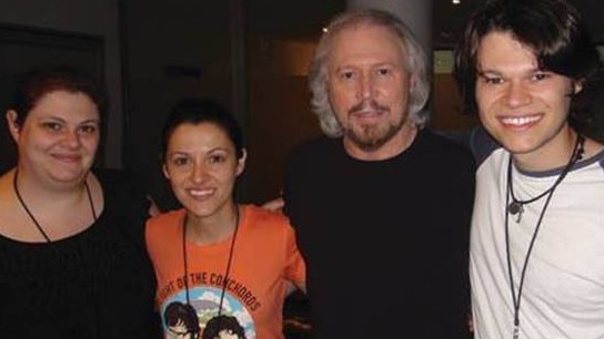 Christine, Ria and Ross Pirrelli with Barry Gibb during the 2013 tour.