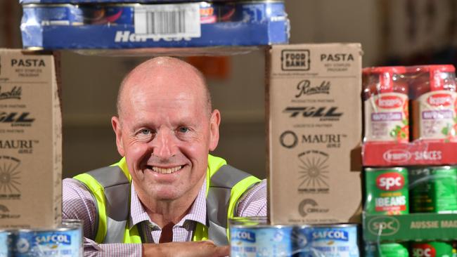 Foodbank SA CEO Greg Pattinson in the warehouse at Edwardstown. Picture: AAP/ Keryn Stevens