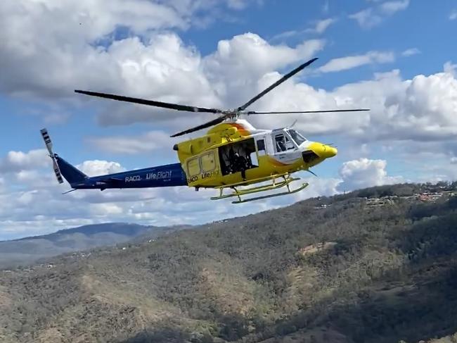 Rescue helicopter attends to injured man after boat fall