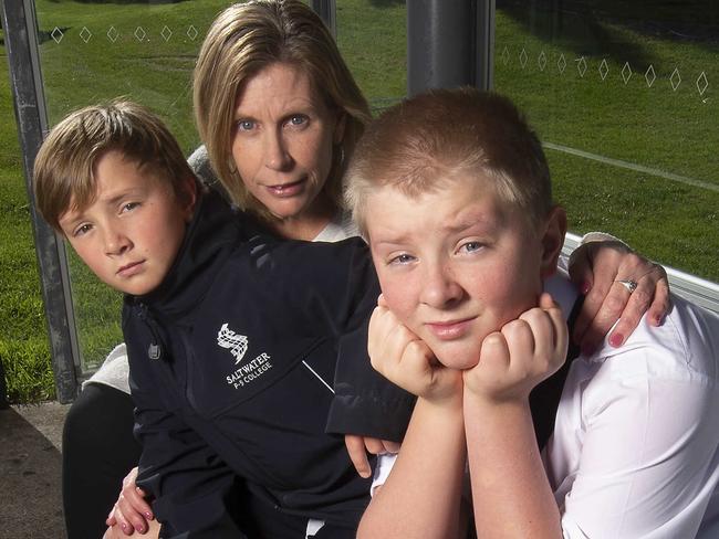 Mum Sam with Ollie 11 and Thomas 13.Point Cook Gercovich family, which has to send son Thomas, 13, to school in Williamstown because Wyndham schools are bursting at the seams. They face having to do the same with Ollie, 11, next year. Tom is on the bus for an hour and a half every day, each way.Picture:Rob Leeson.