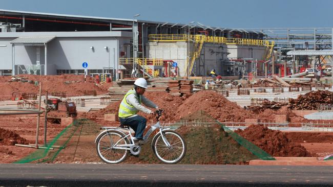 A worker cycles through the site of Lynas Corp.'s Advanced Materials Plant in the Gebeng Industrial Zone near Kuantan, Malaysia, on Thursday, April 19, 2012. Lynas Corp., an Australian mining company, said it's 