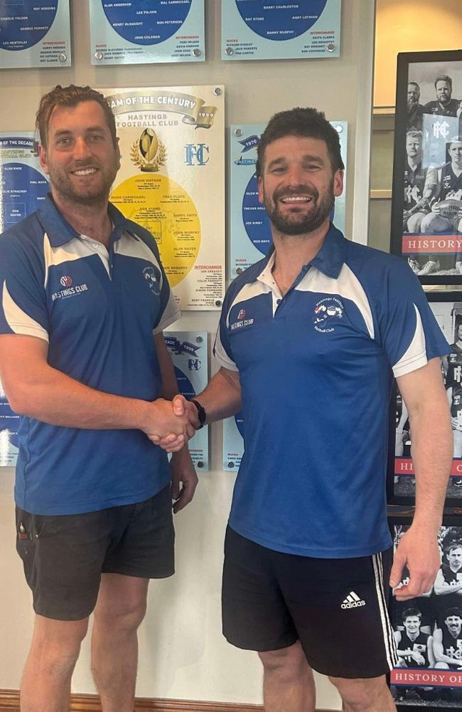 Hastings official Terry Green (left) shakes on it with new coach Kevin Lylak. Picture: Facebook