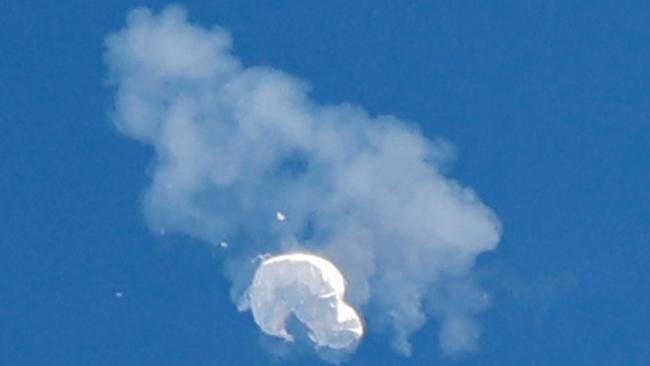 The suspected Chinese spy balloon drifts to the ocean after being shot down off the coast of South Carolina. Picture: Reuters/Randall Hill