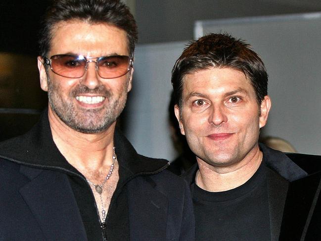 British pop star George Michael (L) smiles with his partner Kenny Goss at a reception after the Japan premiere of his autobiographical movie &George Michael, A Different Story& at a restaurant in Tokyo. George Michael said he will attend next week's wedding of fellow gay pop icon Elton John and will probably tie the knot himself in June under Britain's new civil partnership law. AFP PHOTO / Yoshikazu TSUNO