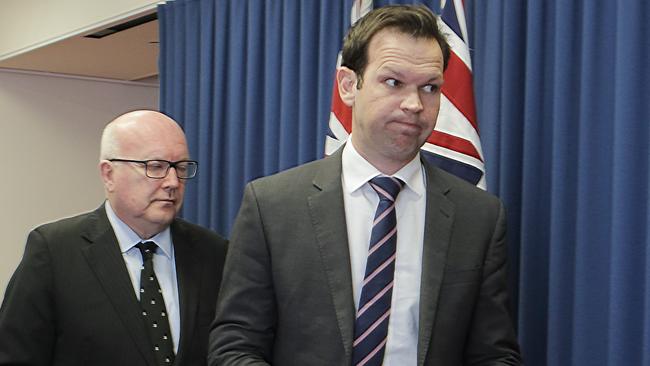 Attorney-General George Brandis, left, and former resources minister Matt Canavan yesterday. Picture: AAP