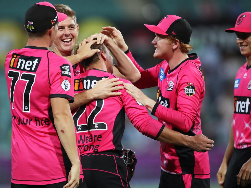 Sydney Sixers mob Josh Philippe after his match winning innings during their clash with the Hobart Hurricanes at the SCG last season