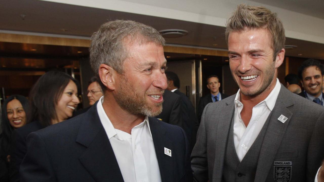 Russian billionaire oligarch and Chelsea owner Roman Abramovich speaking David Beckham.