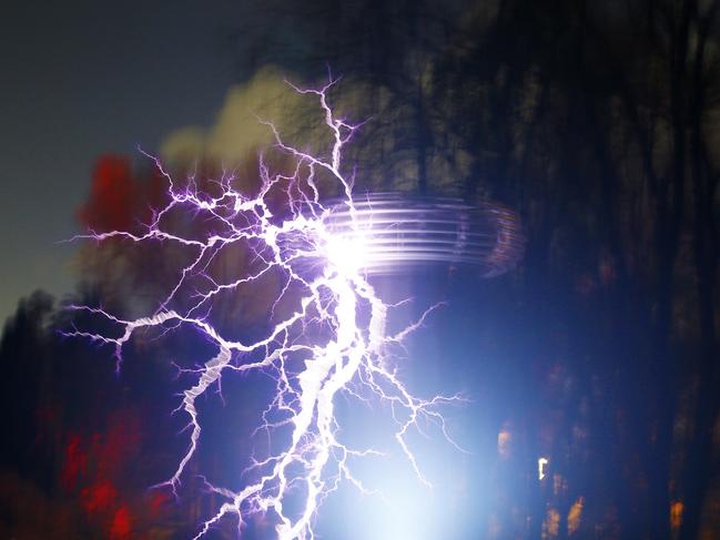 A Tesla machine puts on an electrifying display in the Royal Tasmanian Botanical Gardens. Picture: MATT THOMPSON