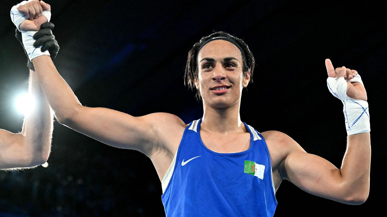 Algeria's Imane Khelif celebrated a win. Photo by MOHD RASFAN / AFP.