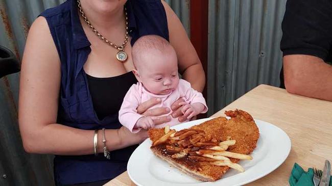 Sarah Atkins and daughter Jorja check out the steak at the Pinnacle pub.