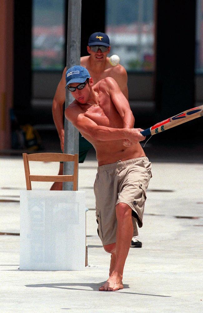 Grant Hackett hits out during a game against the Australian cricket team in the village.