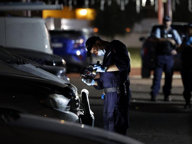 Forensic officers collecting evidence at the Christ The Good Shepherd Church in Wakeley after the terror attack and riot. Picture: Jonathan Ng