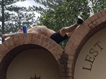 Men photographed sleeping in and on top of the Burleigh Heads War Memorial. Picture: Supplied