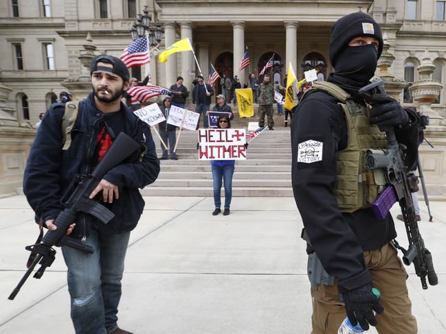 Protesters carry rifles in Lansing, Michigan. Picture: AP