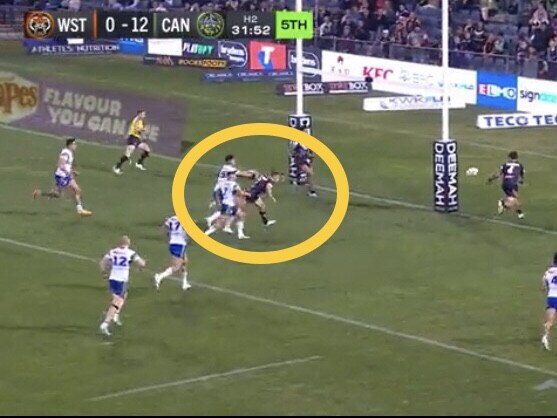 Luke Brooks cops a shove in the back. Picture: Fox League