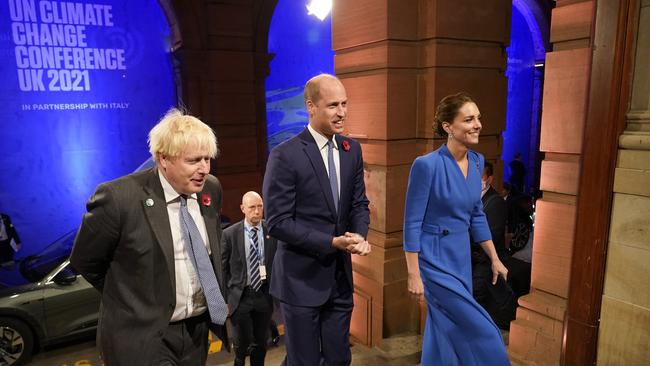 British Prime Minister Boris Johnson, left, greets Prince William and Catherine, Duchess of Cambridge, in Glasgow on Tuesday. Picture: Getty Images