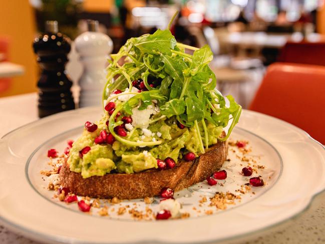 Madame Clarke’s Another Smashed Avo includes a generous pile of smashed avo atop a slice of sourdough toast, all topped with crumbled feta, Middle Eastern dukkah spice blend and bright pomegranate seeds. Picture: Linda Higginson