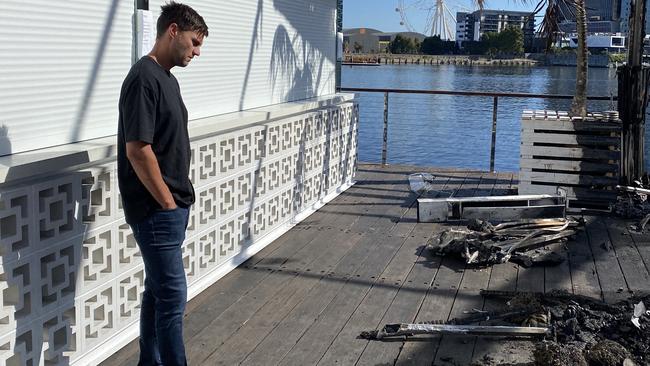 Jake Hughes, founder of floating Docklands nightclub ATET, surveys the wreckage. Picture: Owen Leonard