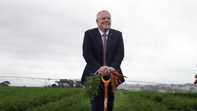 NEWS2019ELECTION17/4/2019. DAY7/Job1The Prime Minister Scott Morrison on the election campaign in Davenport, Tasmania with Michael McCormack, Richard Colbeck Senator Steve Martin- Nationals Senator for Tasmania, Gavin Pearce- Liberal Candidate for Braddon, Sally Milbourne- National Candidate for Braddon and Jim Ertler- Managing Director of Premium Fresh carrot farm.Picture Gary Ramage