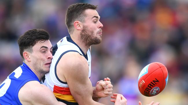 Brad Crouch of the Crows handballs against the Western Bulldogs. Picture: Quinn Rooney/Getty Images