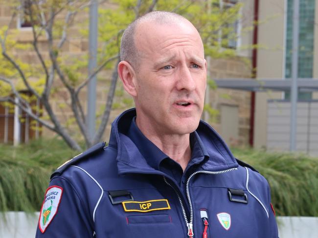 Ambulance Tasmania CEO Joe Acker and Premier Jeremy Rockliff speak to the media at Parliament Square in Hobart on Tuesday, October 18, 2022.
