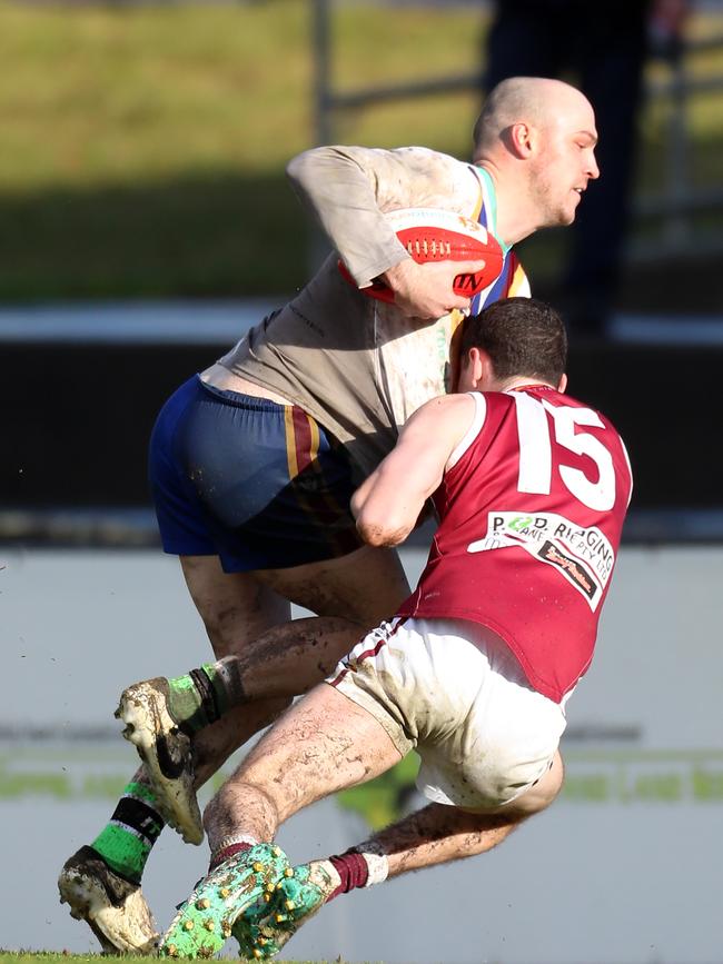 Moe’s Riley Baldi attempts to break free of a tackle applied by Traralgon’s Lucas Tripodi.