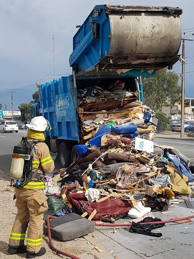 A rubbish truck dumped its load on Grand Junction Rd after the driver noticed smoke from the rear of truck. Picture: Port Adelaide Enfield Council