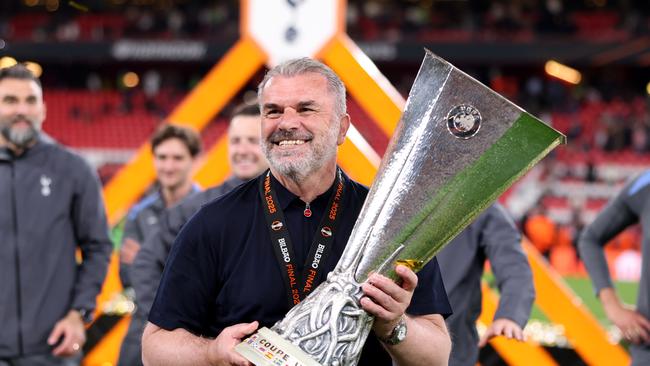 Tottenham Hotspur manager Ange Postecoglou, celebrates with the UEFA Europa League trophy. Picture: Alex Pantling – UEFA/UEFA via Getty Images