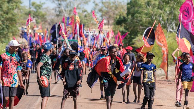 Gurindji people march with visitors, celebrate the 56th anniversary of the Wave Hill Walk Off marking the start of the land rights movement across Australia with a weekend of sport, Politics and Culture. Picture: Glenn Campbell/NLC