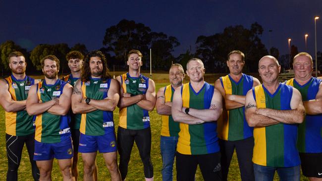 Golden Grove Football Club players Michael Walters, Todd Sheppard, Tom Tacono, Rohan Shenton and Connor Hillcoat in the replica heritage jumpers with inaugural players Brett Elsworthy, Kym Dobie, Mick Grandey, Phil Jordan and Steve McGregor in original guernseys. Picture: Brenton Edwards