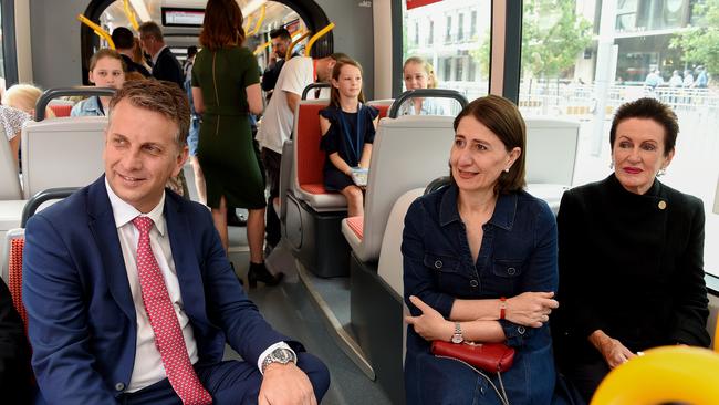 Low-commotion: NSW Transport Minister Andrew Constance, Premier Gladys Berejiklian and Lord Mayor of Sydney Clover Moore ride the new light rail. Picture: AAP Image/Bianca De Marchi