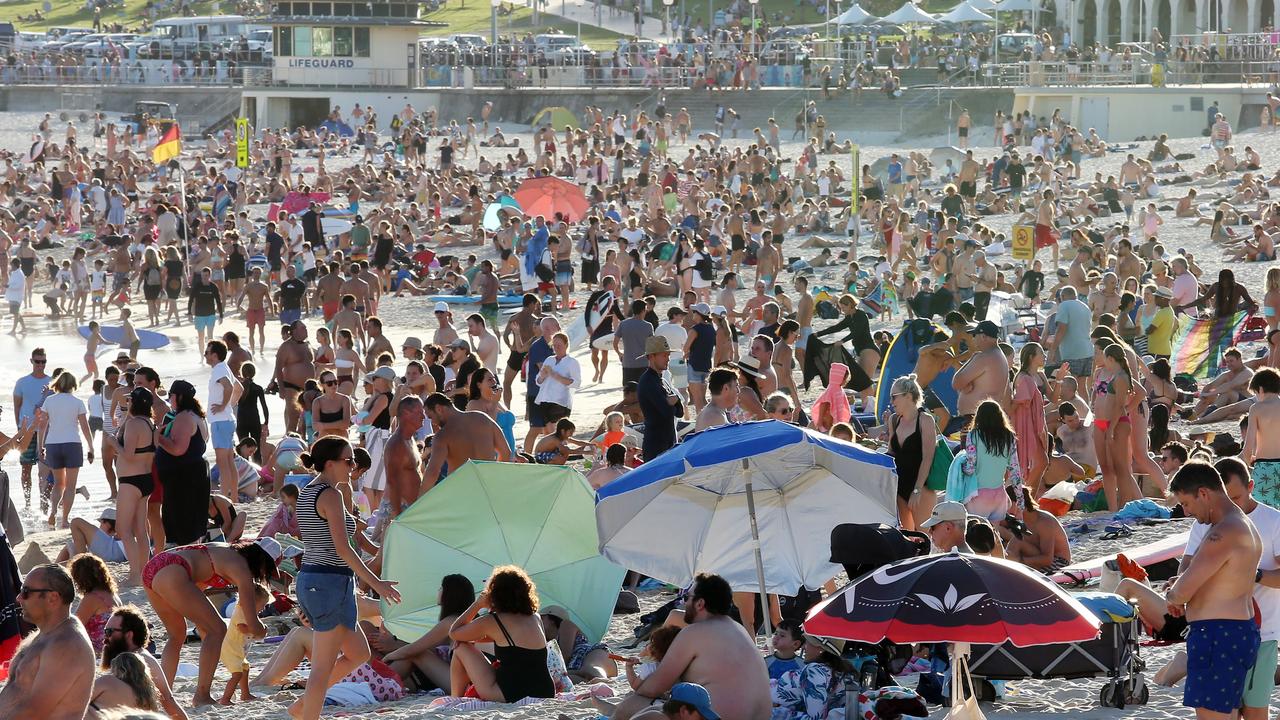 People folk to Bondi Beach despite the threat of the coronavirus on Friday. Picture: John Fotiadis/AAP