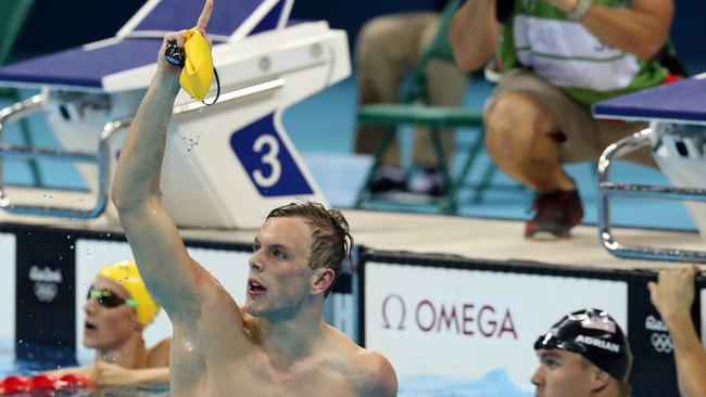 Kyle Chalmers celebrates gold in the 100m freestyle.
