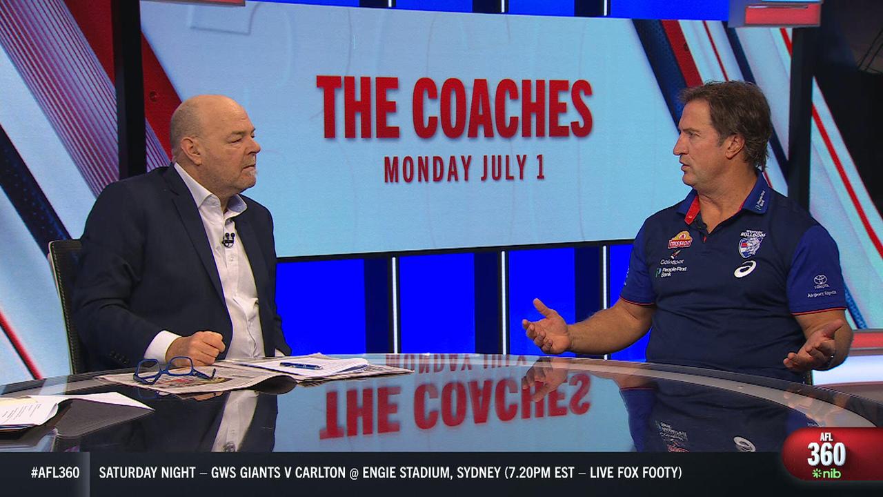 Mark Robinson and Luke Beveridge engaged in a tense debate.