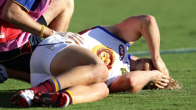 Daniel Rich in agony after injuring his knee in Round 3. Picture: Adam Head