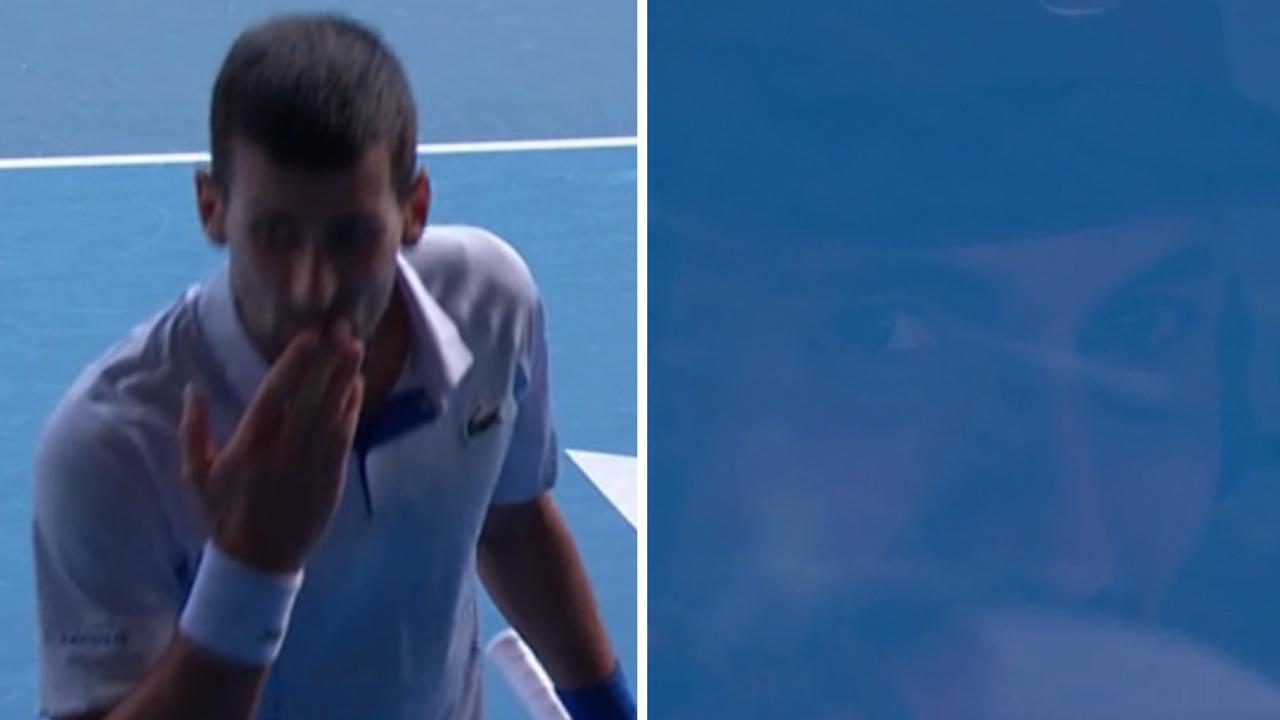 Novak Djokovic blows Nick Kyrgios a kiss.