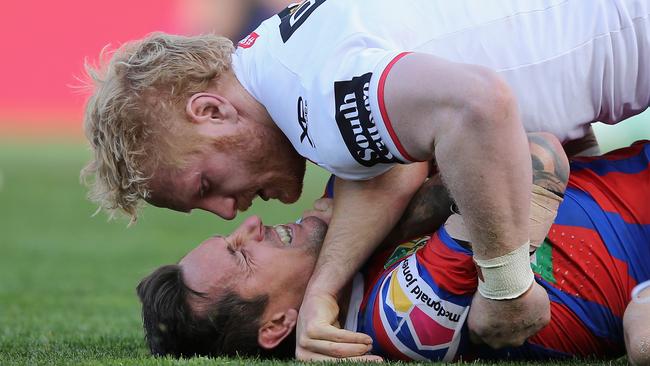 NEWCASTLE, AUSTRALIA — SEPTEMBER 01: Mitchell Pearce of the Knights is tackled by James Graham of the Dragons during the round 25 NRL match between the Newcastle Knights and the St George Illawarra Dragons at McDonald Jones Stadium on September 1, 2018 in Newcastle, Australia. (Photo by Ashley Feder/Getty Images)