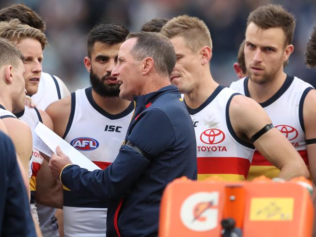 Adelaide coach Don Pyke talks with his players during their round 19 loss to Carlton at the MCG in Melbourne. Picture: AAP IMAGE/DAVID CROSLING