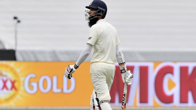 England's Moeen Ali walks off after he was caught out by Australia for 20 runs. Picture: AP.