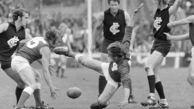 North Adelaide legend Barrie Robran is ripped off the ball playing against Carlton at Adelaide Oval in 1972.